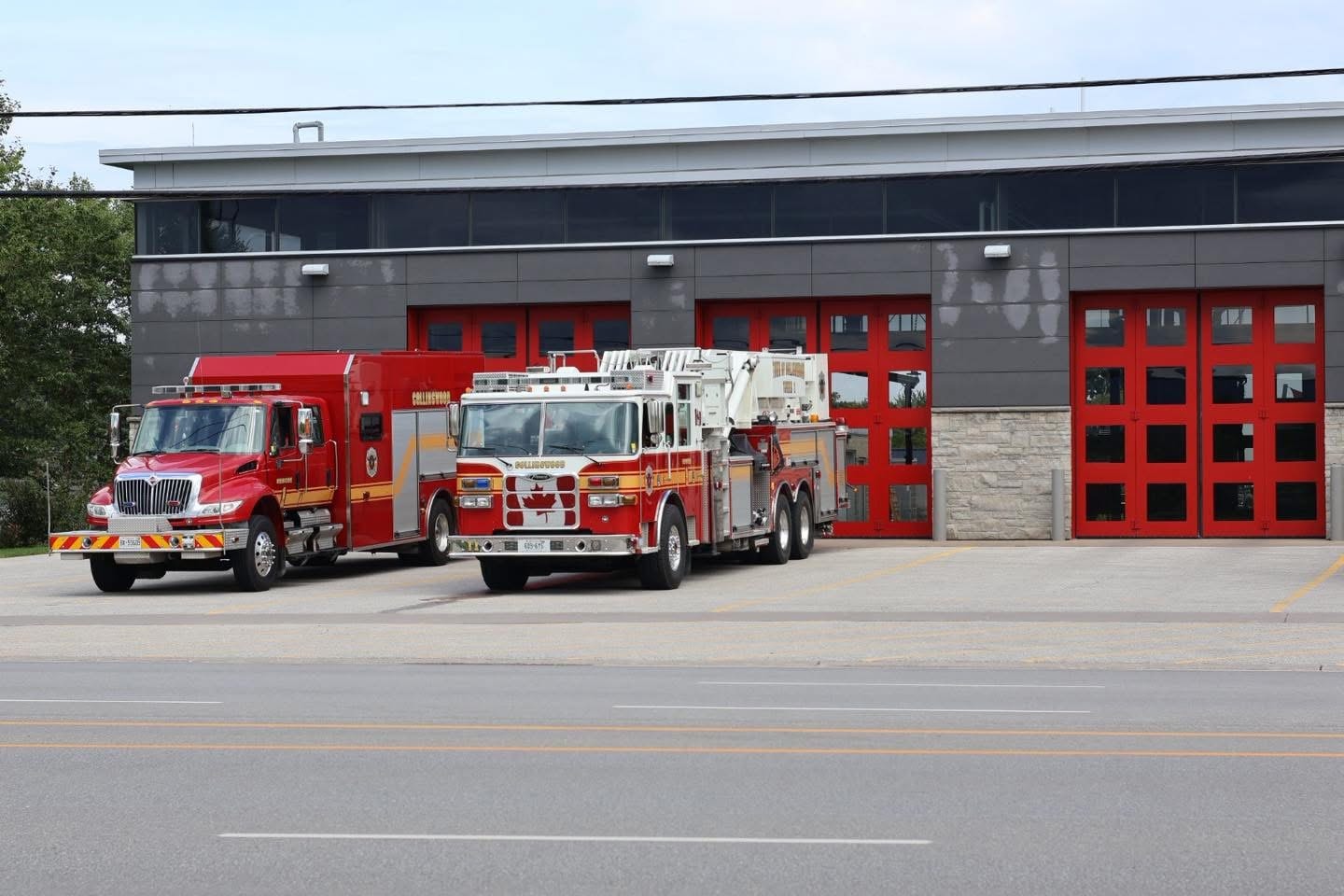 Collingwood Fire ladder truck and pumper at the station at night